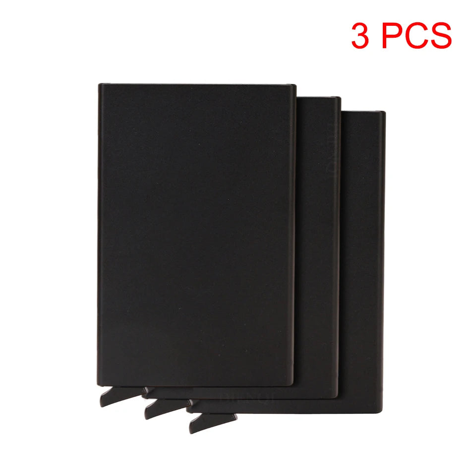 Three black slim metal RFID blocking card holders with a pop-up design
