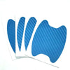 A pack of blue carbon fiber film protecting a car door handle.
