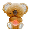 A brown koala plush toy with closed eyes, featuring a soothing light and sounds.