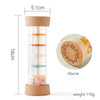 A wooden rain rattle sensory toy with a clear tube, measuring 16cm tall and weighing 110g.