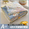 A lightweight summer quilt featuring a playful cartoon print with various colorful patterns.