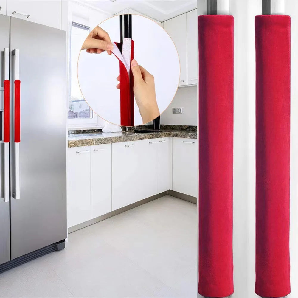 Two red velvet anti-skid handle covers for kitchen appliances displayed next to a stainless steel refrigerator.