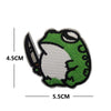A green animal applique patch featuring a hook and loop backing.
