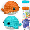Two crocheted sea creature toys, one orange and one blue, displayed next to the DIY crochet kit.