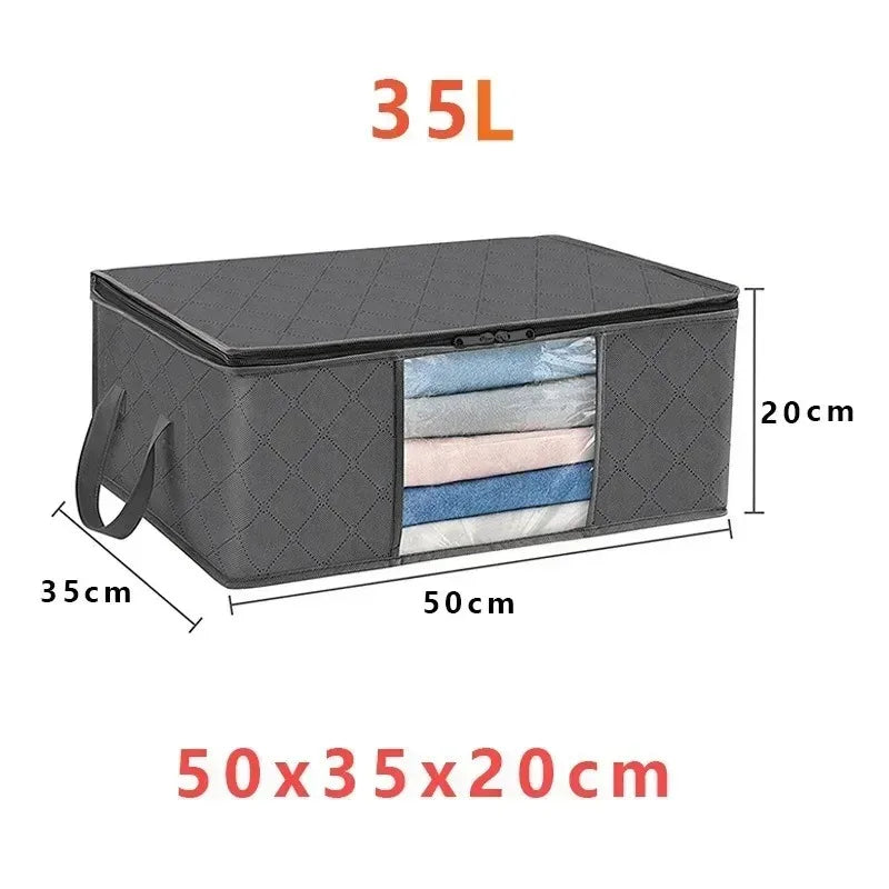 A dark gray foldable storage bag with a transparent window showing several folded textiles.