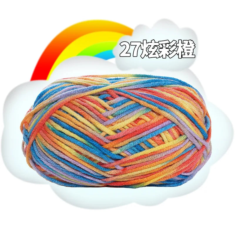 A ball of multi-colored milk cotton blend yarn with various shades of orange, blue, and yellow.