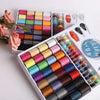 A kit of 64-color sewing thread spools organized in a portable storage case with various colors visible.