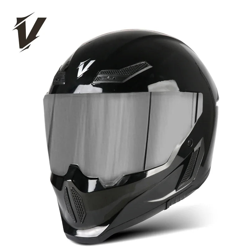 A black full-face motorcycle helmet with a clear visor and ventilation grilles.
