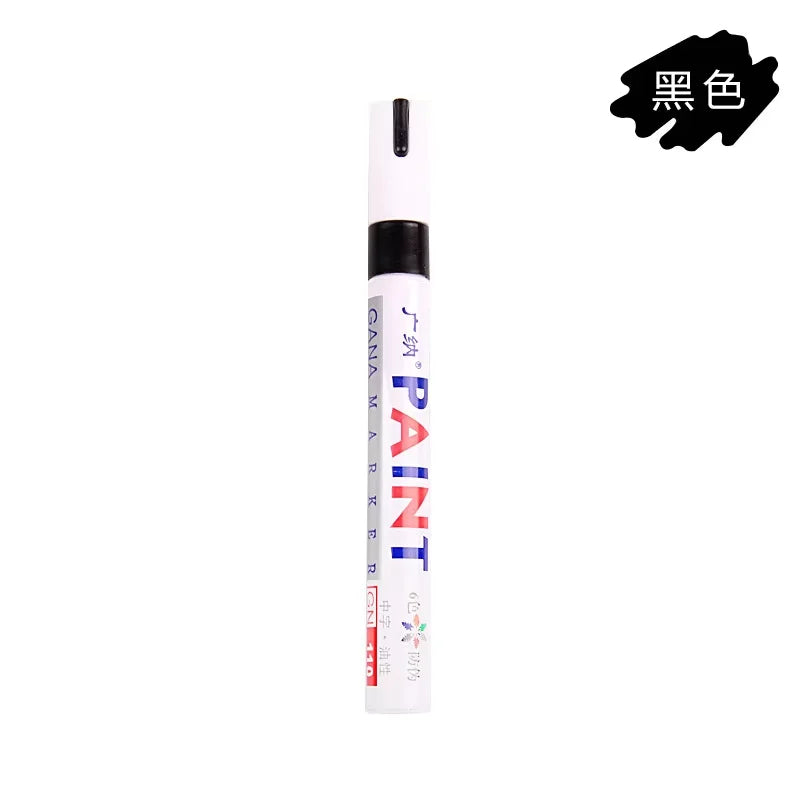 A black paint touch-up pen with a white body and a silver cap.