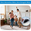 A woman and a man are demonstrating reusable non-slip rug grippers on a light-colored rug.