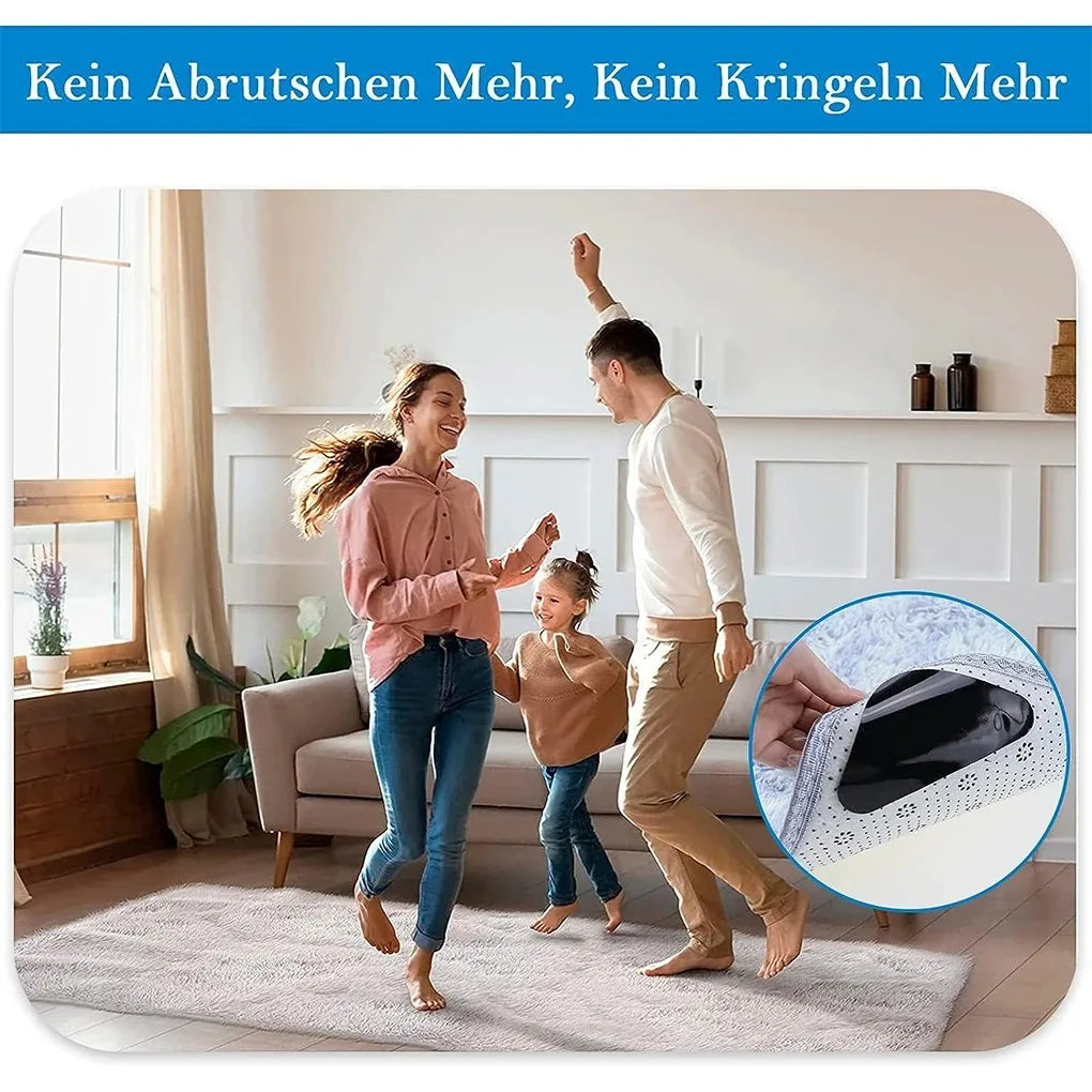 A woman and a man are demonstrating reusable non-slip rug grippers on a light-colored rug.