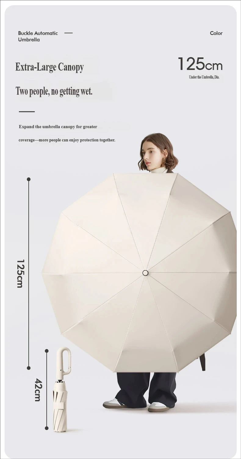A beige buckle automatic umbrella is shown open, demonstrating its large canopy size and folding mechanism.