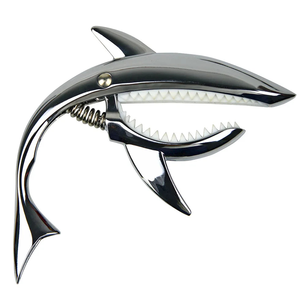 A silver pro-grade zinc alloy guitar capo with a curved neck and a serrated top plate.