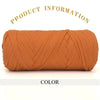 A skein of thick, orange-brown polyester blend yarn coiled for knitting or crochet.