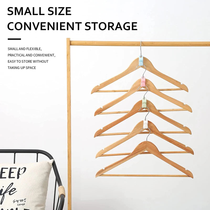 A set of wooden cascading clothes hanger connectors used for space-saving wardrobe organization.