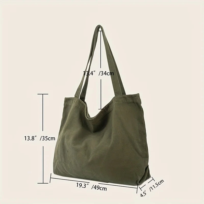 Sac à main en toile de couleur vert olive, avec diverses mesures.