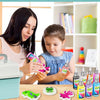 A girl and woman are painting a 3D water elf science kit for kids on a wooden table.