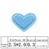 A light blue heart-shaped iron-on patch with a textured surface.