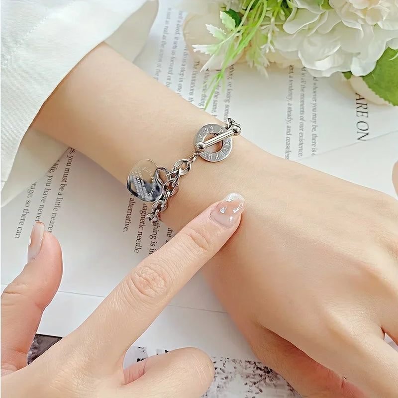Bracelet en acier inoxydable avec pendentif double cœur