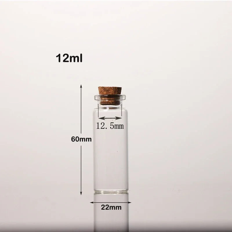 A clear glass bottle with a cork stopper is shown next to a measurement scale, indicating a 12ml volume and dimensions.