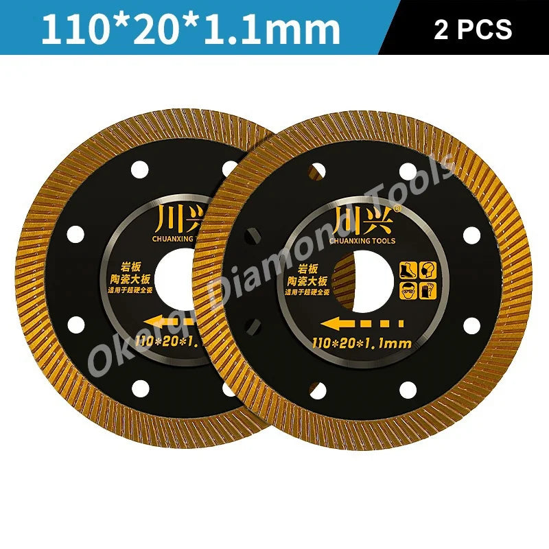 Two black diamond saw blades with gold edges and center holes, measuring 110x20x1.1mm each.