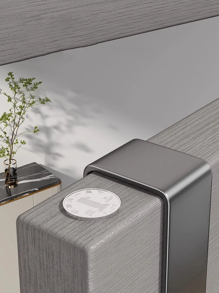 A close-up of a modern, rectangular organizer rack with a circular plate on top, set against a neutral gray background.