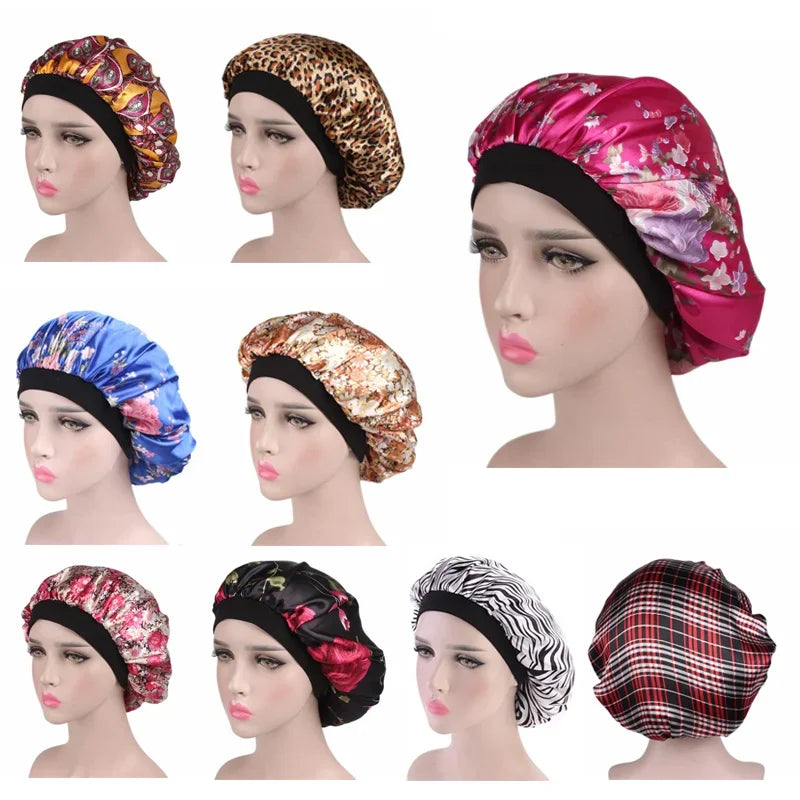 A collection of satin hair bonnets in various floral and patterned designs shown on a mannequin head.