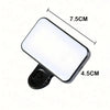 A portable clip-on LED selfie light with a rectangular white light panel and a black clip.