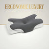 Grauer ergonomischer Memory-Foam-Nackenkissen mit weißen Akzenten vor hellem Hintergrund.