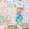 A collection of vintage floral scrapbook paper sheets in various colors and patterns for crafting.