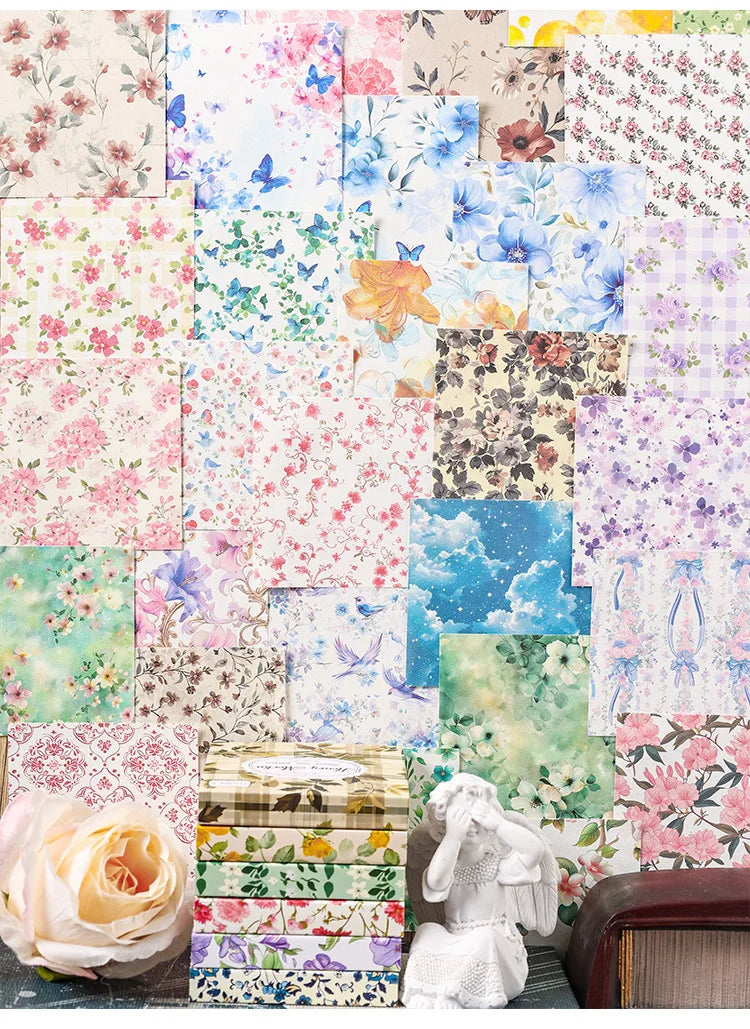 A collection of vintage floral scrapbook paper sheets in various colors and patterns for crafting.