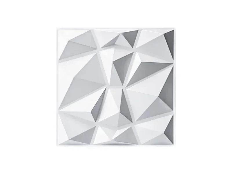 A close-up view of a white, geometric 3D diamond wall panel design.