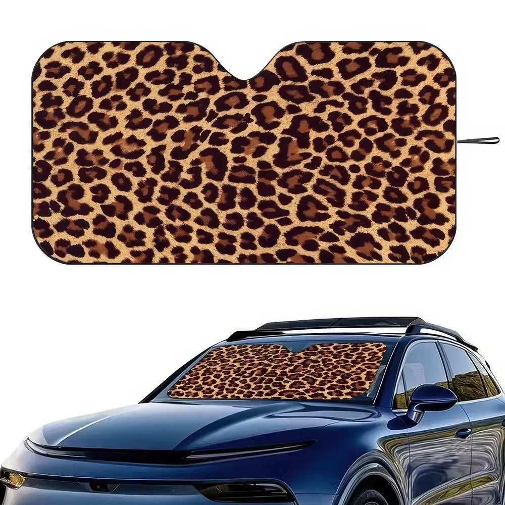 Leopard print car windshield sunshade applied to a blue car.