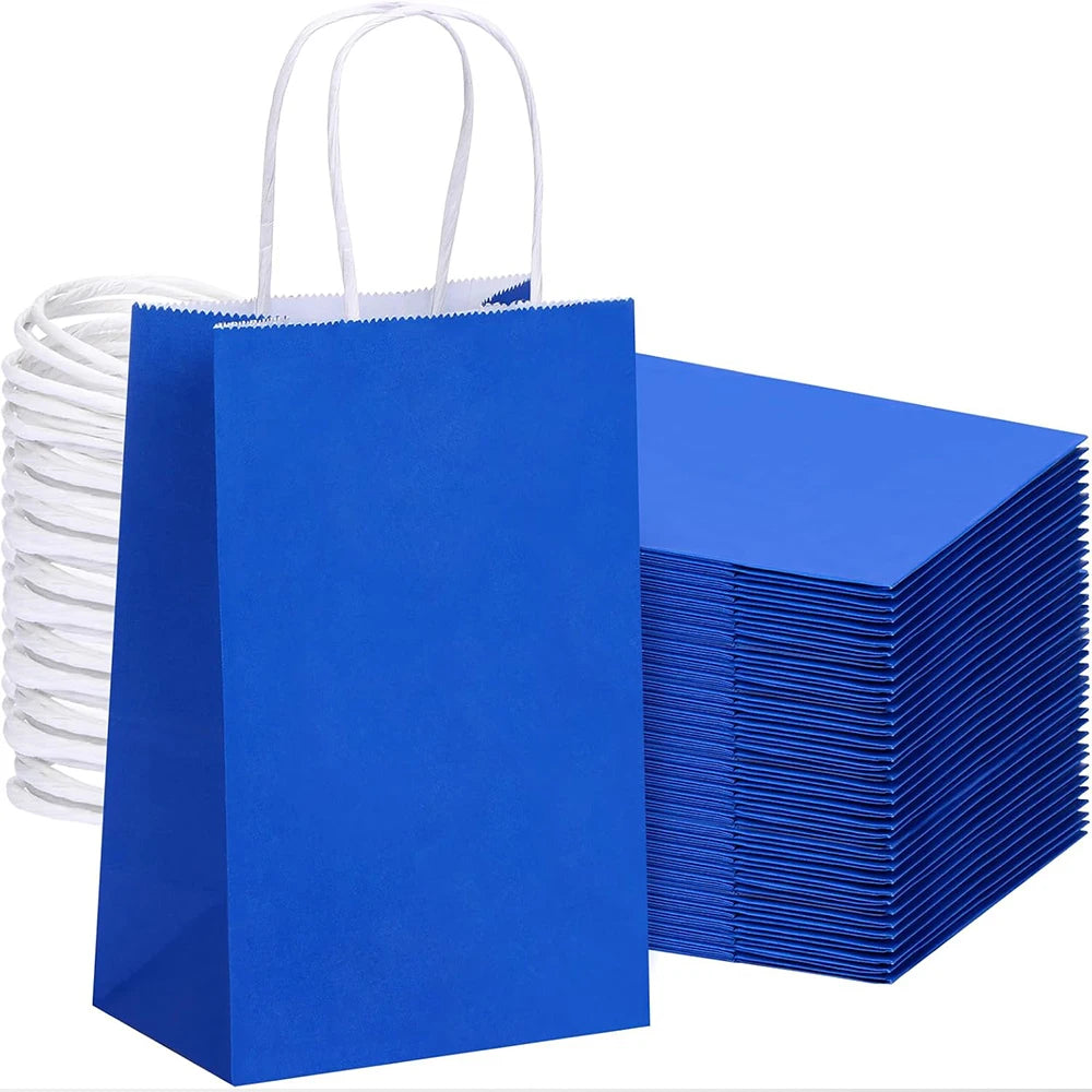 A stack of bright blue kraft paper gift bags with white handles.