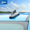 Chrome-style car antenna cover trim installed on a blue vehicle roof.