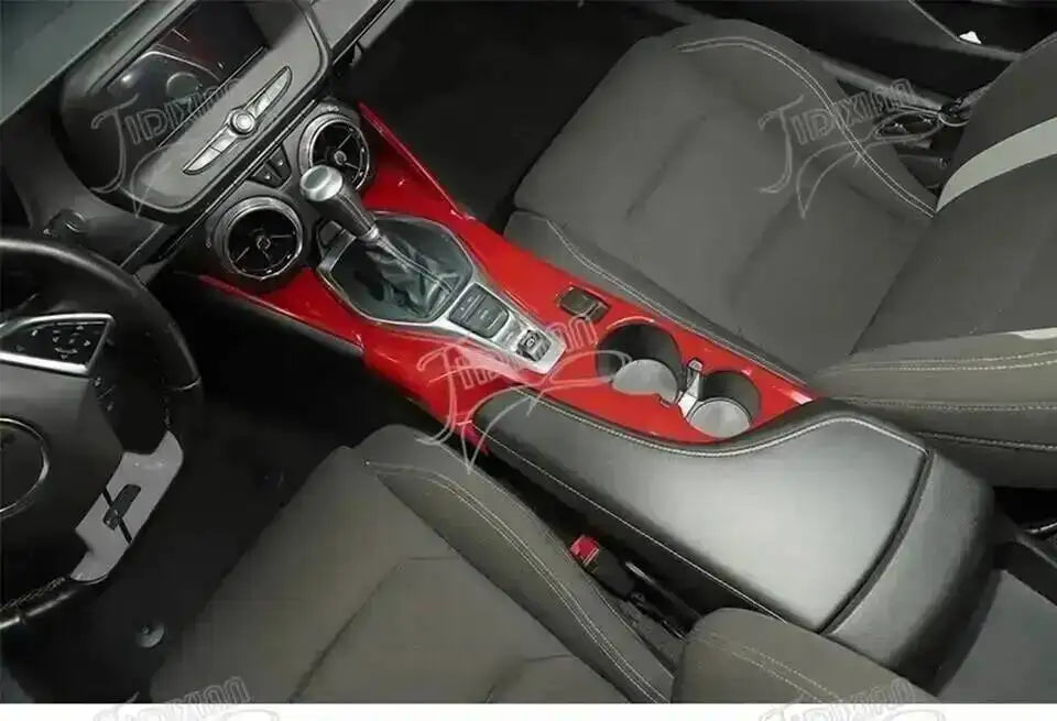 Interior view of a Chevrolet Camaro showing red trim and leather seating.