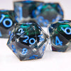 A close-up of a set of liquid core resin dice showing dragon eye designs and various numbers.