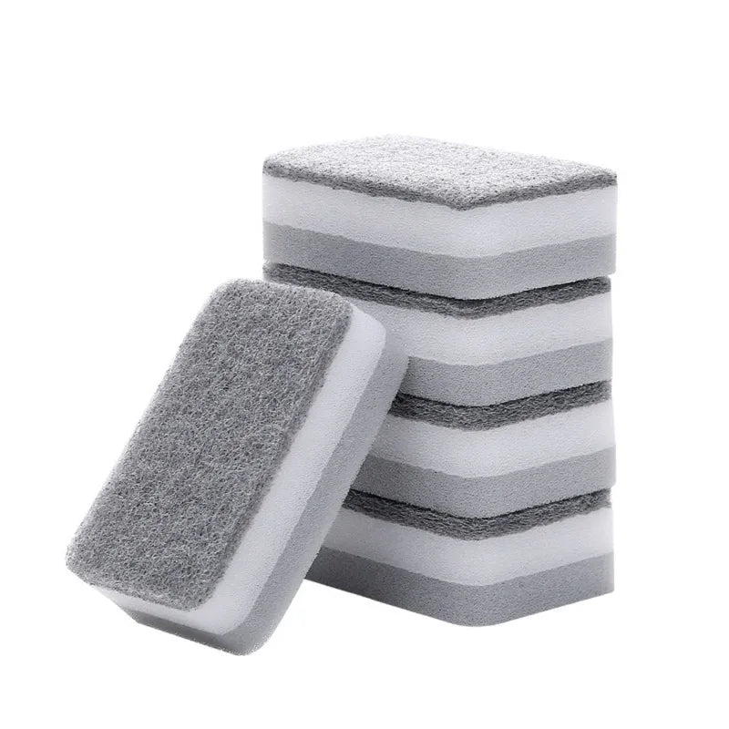 A stack of gray and white double-sided cleaning sponges or scouring pads.