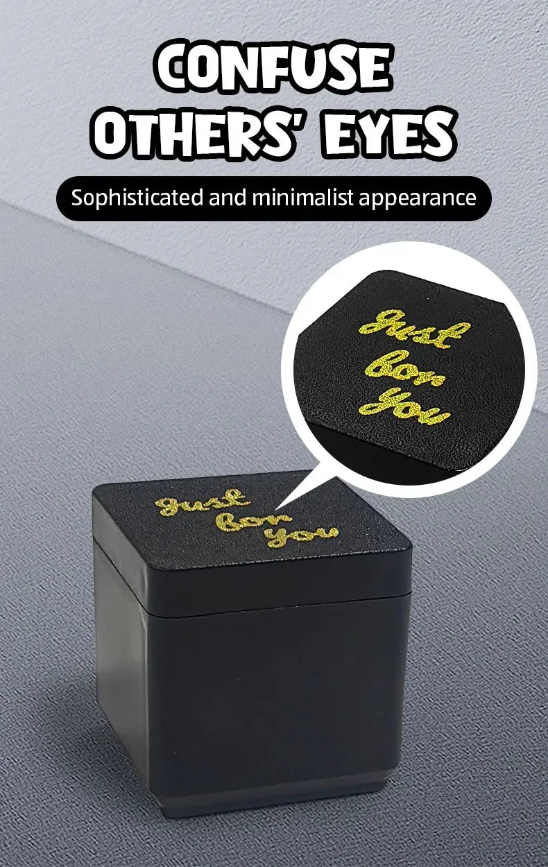 A black box with gold text that reads Just bow you is shown on a gray surface.