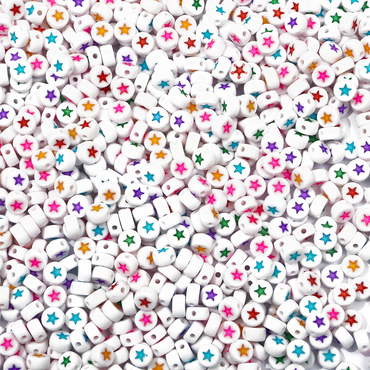A close-up view of small white acrylic letter beads in various colors like pink, yellow, green, and blue.