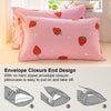 Pink strawberry print pillowcase and duvet cover set shown on a bed.