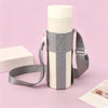 A light gray breathable mesh crossbody water bottle carrier with a white bottle, shown against a pink background.