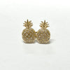 Gold-toned jewelry featuring pineapple motifs used as a no-sew adjustable waist tightener for clothing.