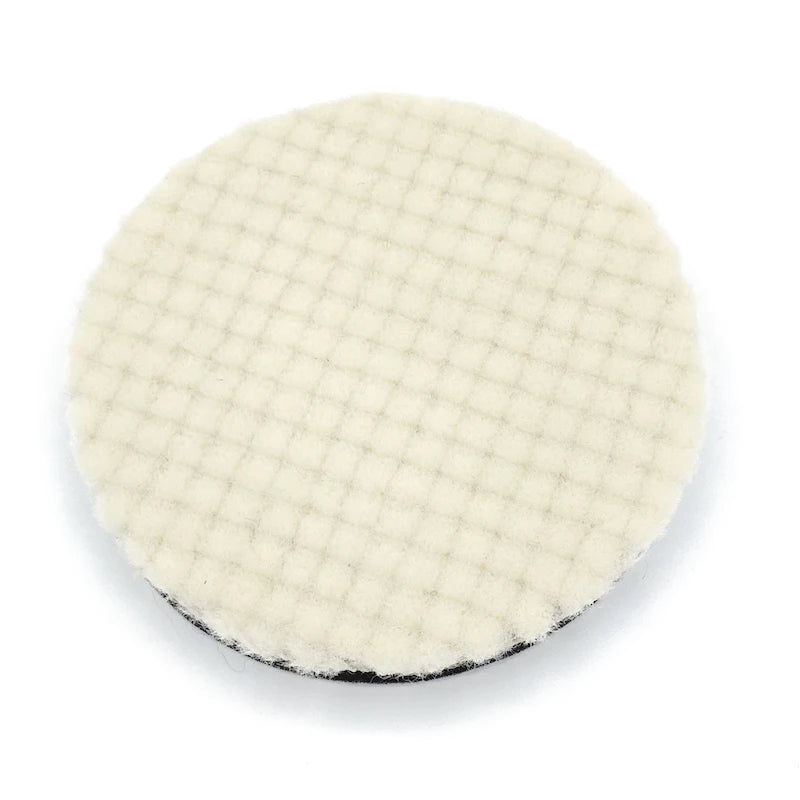 A circular white car polishing wool pad with a textured surface and black edge.