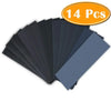 A stack of 14 assorted sandpaper sheets in various shades of gray and black.