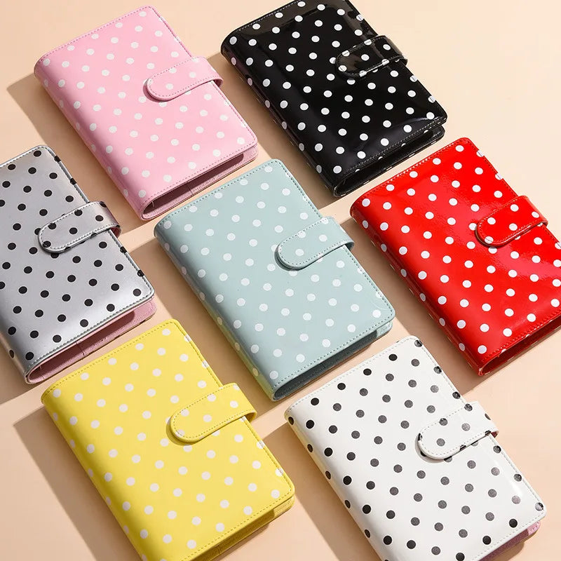 A collection of colorful polka dot PU leather binder wallets and card holders in pink, black, mint green, red, yellow, and wh