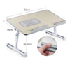 An adjustable foldable laptop desk with a light wood-colored surface and silver metal legs.
