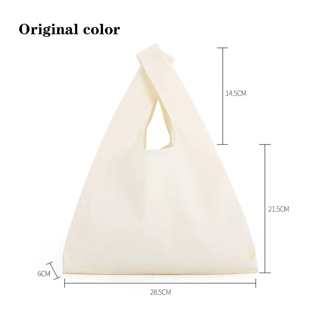 A beige foldable canvas tote bag shown flat with dimensions 28.5cm long and 14.5cm high.