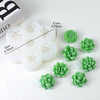 A set of white and green silicone molds shaped like succulent flowers for DIY crafts.