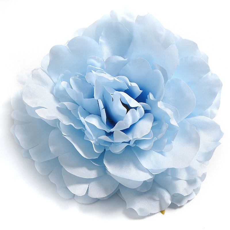 A soft blue silk peony flower head shown in a close-up view.